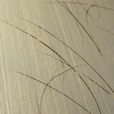 Wide-angle shot of wallpaper in an abstract curved line pattern in gold on a metallic field.