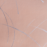 Detail of a wallpaper in an abstract curved line pattern in metallic silver on a pink field.