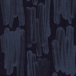Detail of wallpaper in an abstract paint swatch print in blue on a black field.