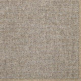 Close-up of a textured beige broadloom carpet with a subtle pattern