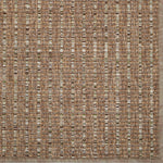 Textured brown and beige woven rug