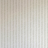 Detail of wallpaper in a repeating striped circular print in gray on a light gray field.