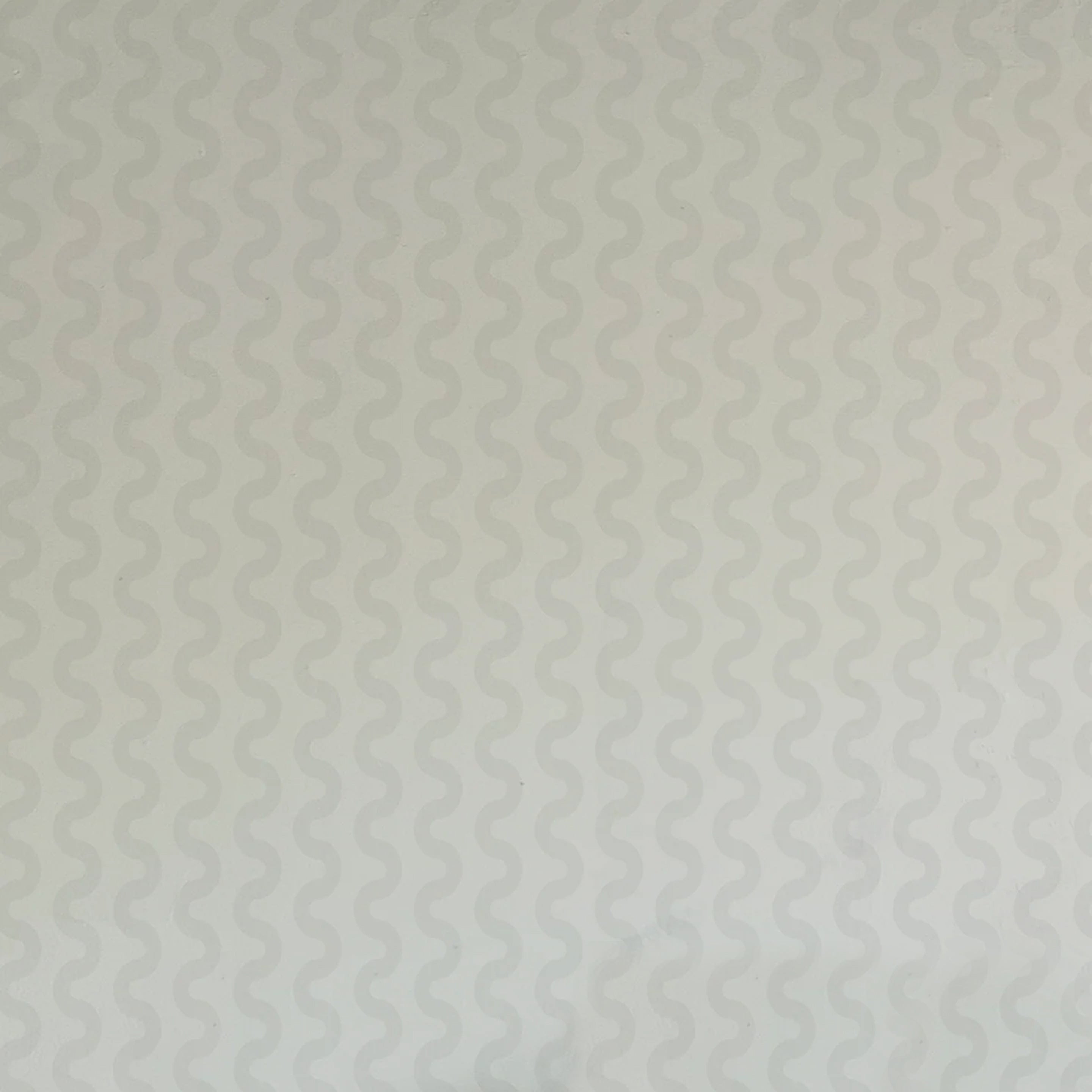 Detail of wallpaper in a playful curvy stripe print in gray on a light gray field.