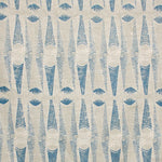 Detail of fabric in an abstract geometric print in tan and navy.