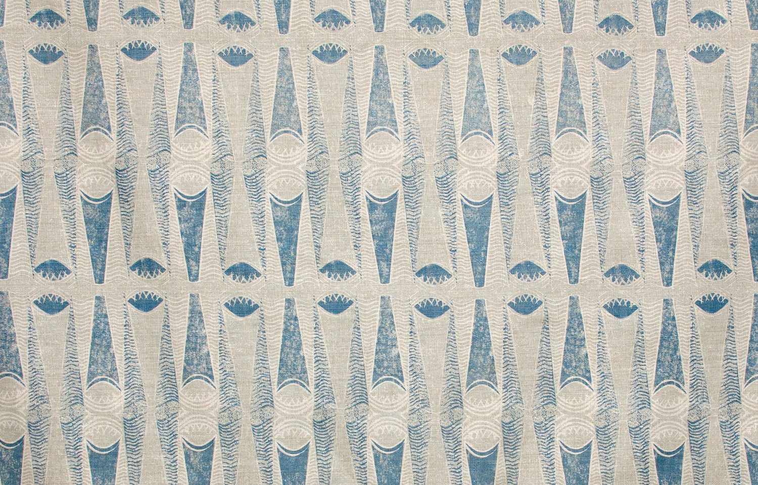 Detail of fabric in an abstract geometric print in tan and navy.