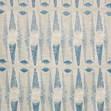 Detail of fabric in an abstract geometric print in tan and navy.