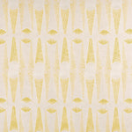 Detail of fabric in an abstract geometric print in yellow and white.
