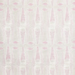 Detail of fabric in an abstract geometric print in light pink and green.