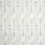 Detail of wallpaper in an abstract geometric print in blue-gray and cream.