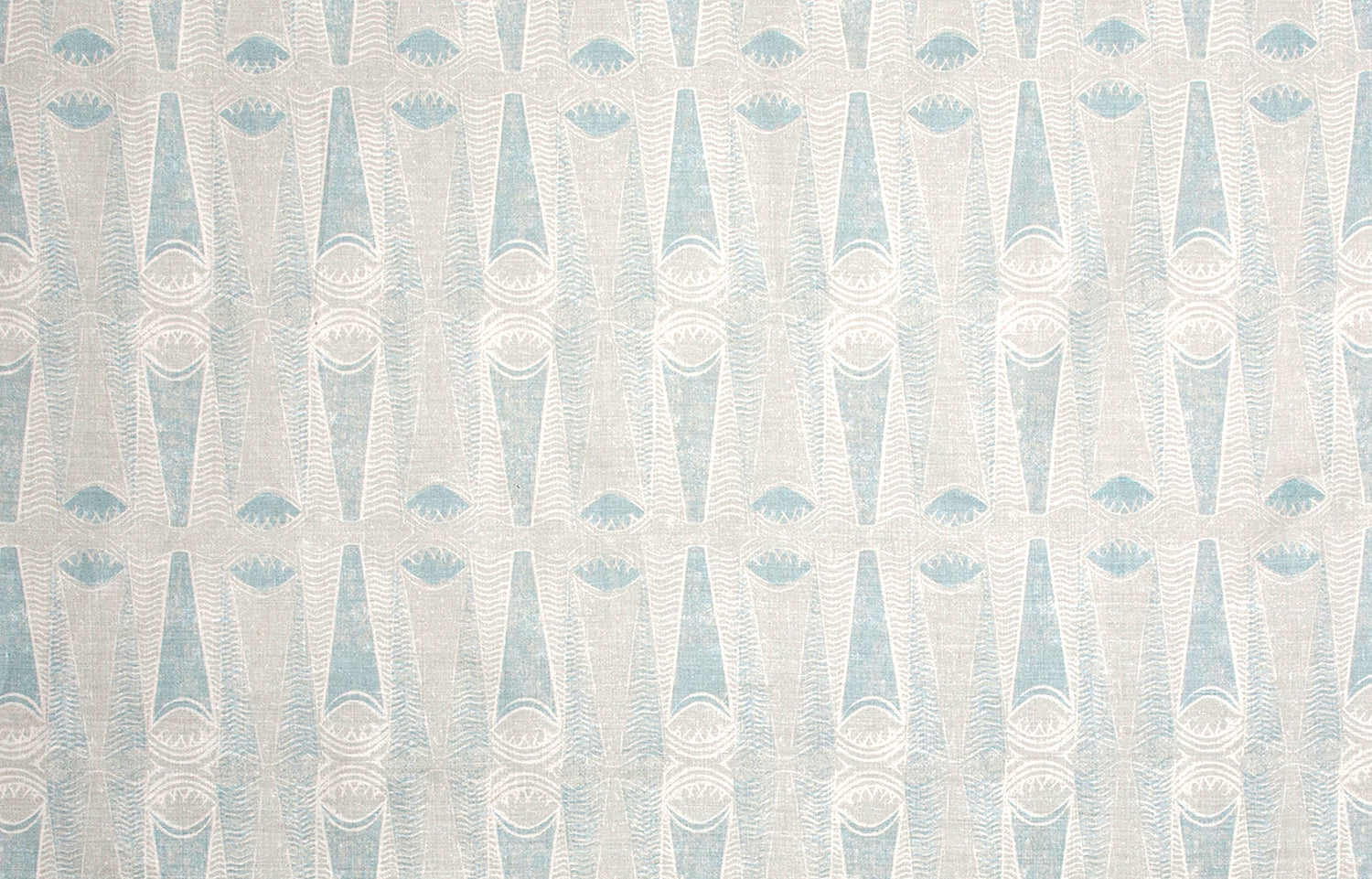 Detail of wallpaper in an abstract geometric print in blue-gray and cream.
