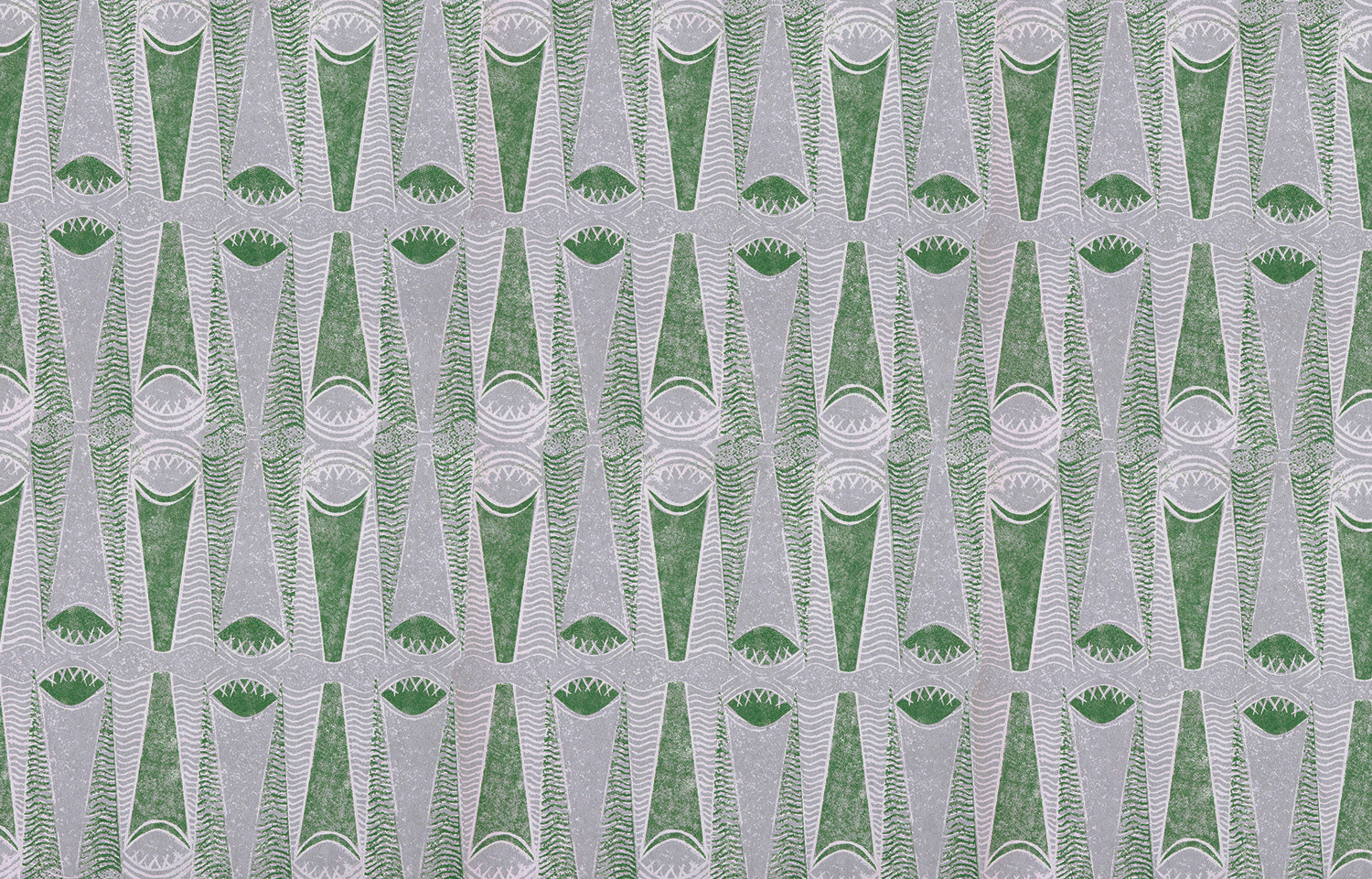Detail of wallpaper in an abstract geometric print in gray and green.