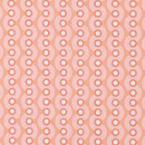 Detail of wallpaper in a playful curving stripe print in pink, white and coral.