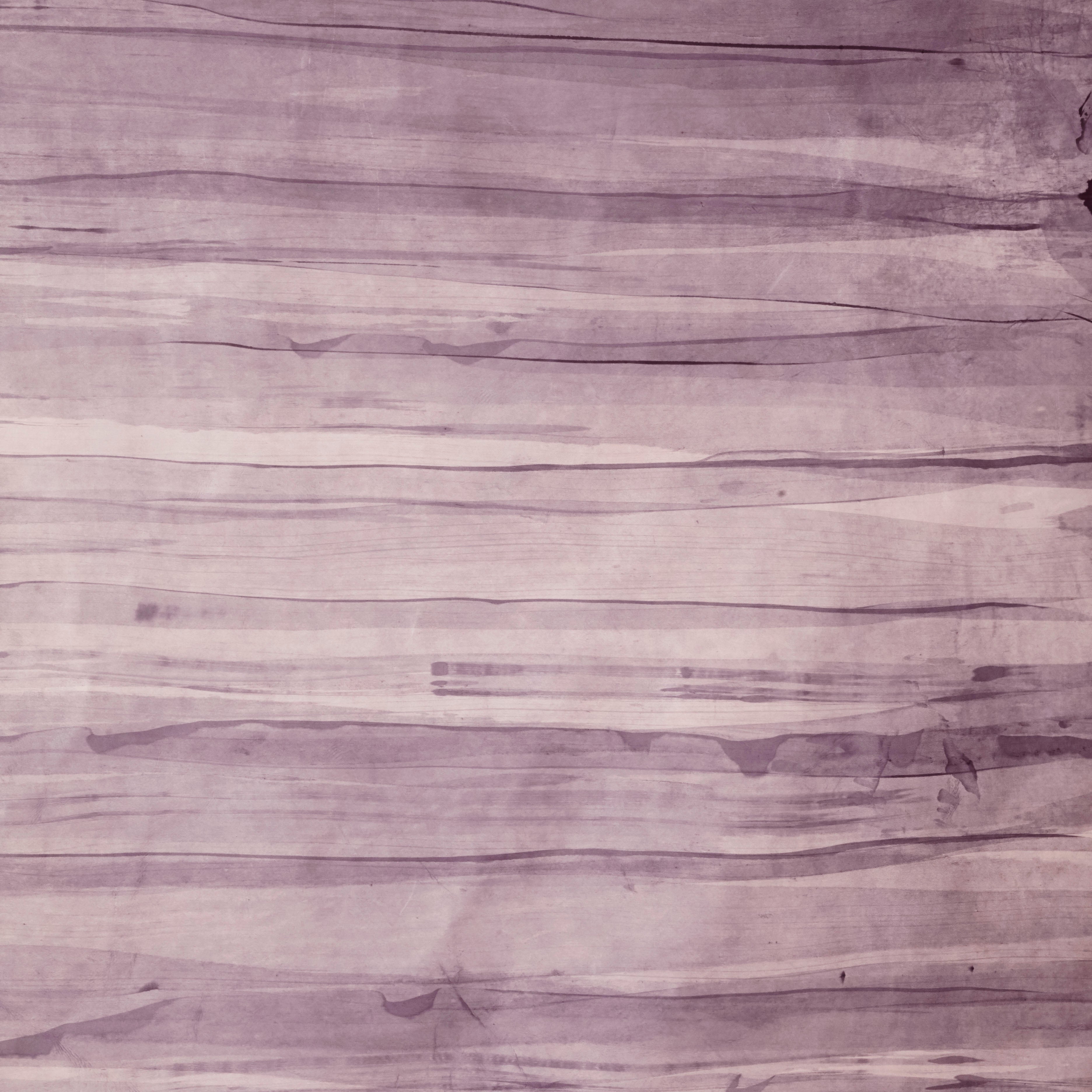 Upholstery leather in purple with an abstract stripe overlay in shades of dark purple.