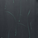 Detail of a wallpaper in an elongated paint splatter pattern in metallic turquoise on a navy field.