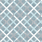 Detail of fabric in a dotted plaid pattern in shades of blue and black on a white field.