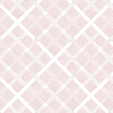 Detail of fabric in a dotted plaid pattern in shades of pink on a white field.