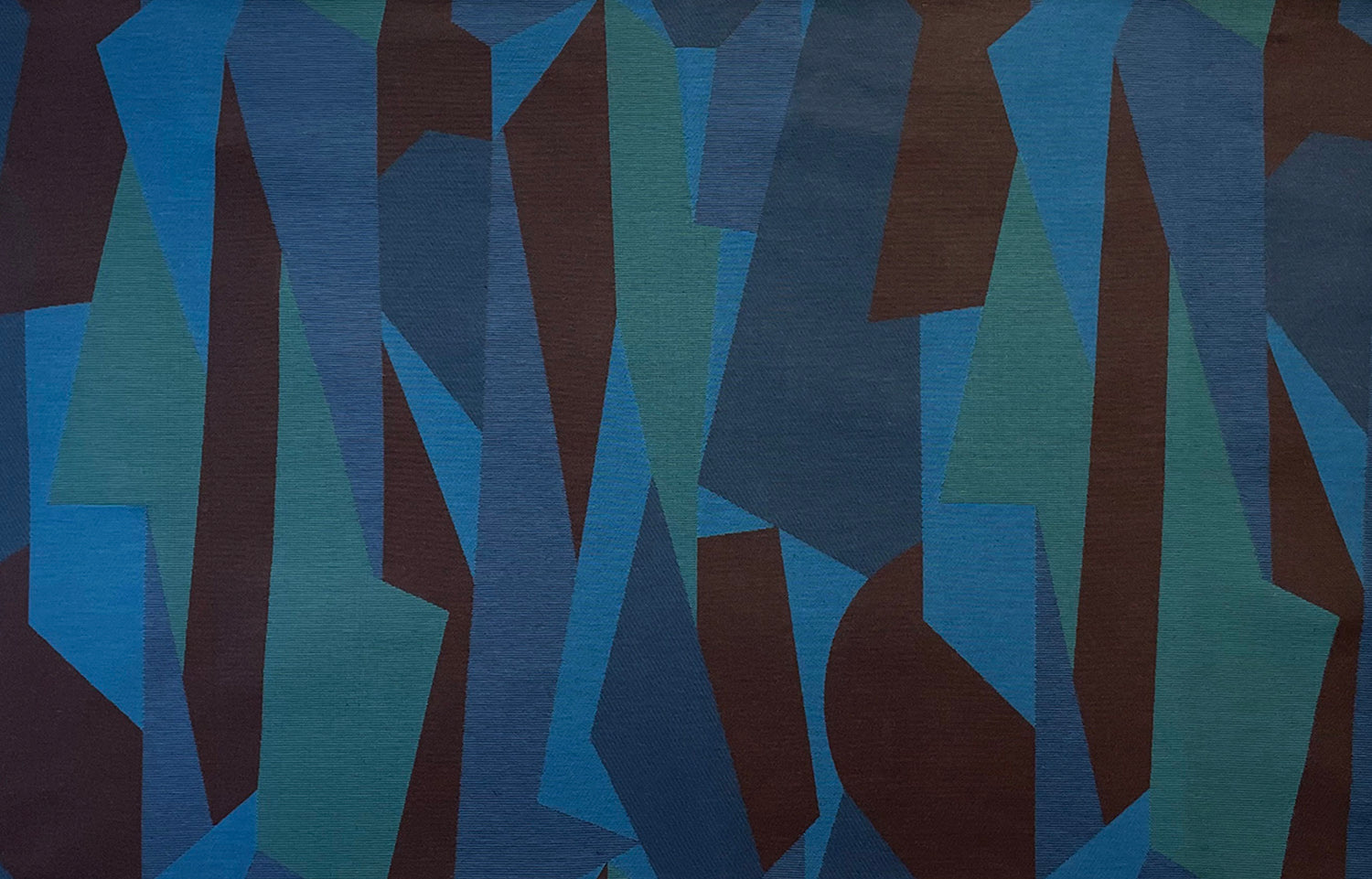 Detail of fabric in an abstract geometric print in blue, green and brown.