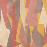 Detail of fabric in an abstract geometric print in pink, yellow, tan and brown.