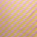 Detail of fabric in a zigzag stripe print in pink on a mustard field.
