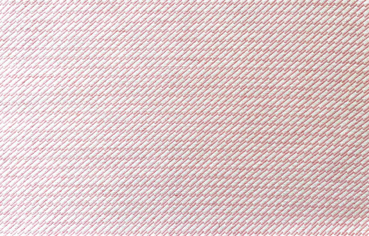 Detail of fabric in a matchstick grid print in pink on a white field.