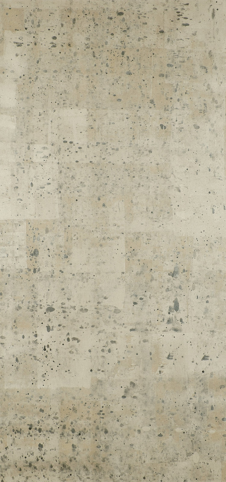 Detail of wallpaper in a minimalist paint slatter print in gray on a tan field.