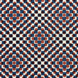 Detail of fabric in a geometric check and polka dot pattern in burnt orange, blue, cream and black.