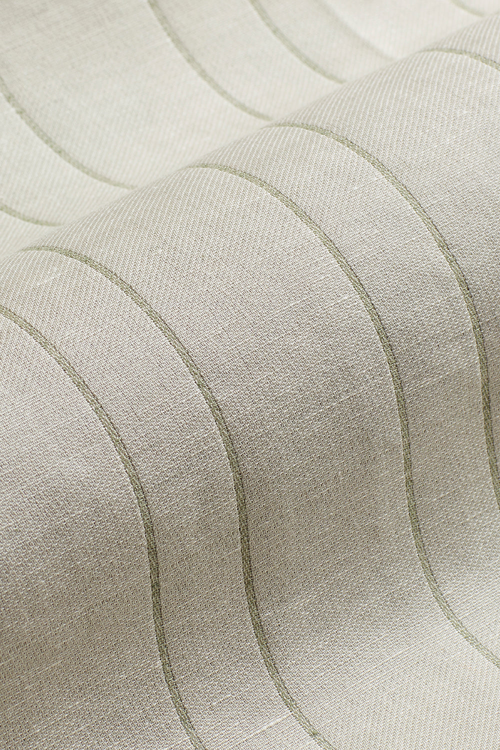 Draped woven fabric in a ivory and sage green stripe.