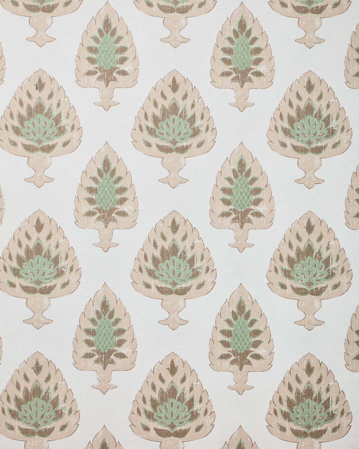 Detail of wallpaper in a botanical damask print in shades of pink, brown and sage on a cream field.