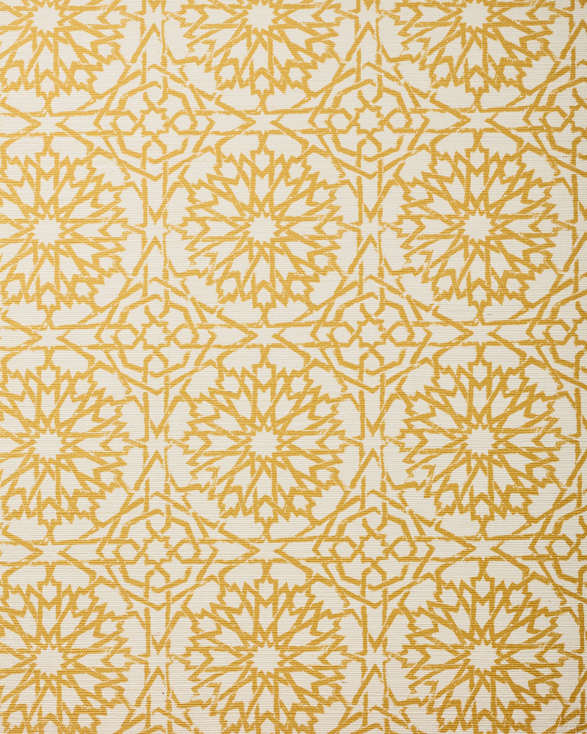 Detail of fabric in a small-scale lattice print in yellow on a cream field.