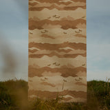 Fabric panel with mountain and horse pattern on grass and sky background