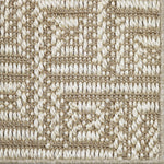 Close-up of a key pattern carpet in beige and white