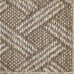 Close up of a woven lattice design carpet in ecru.