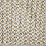 Close-up of a textured sisal carpet in natural.