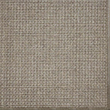 Close-up of a textured woven performance carpet in taupe.