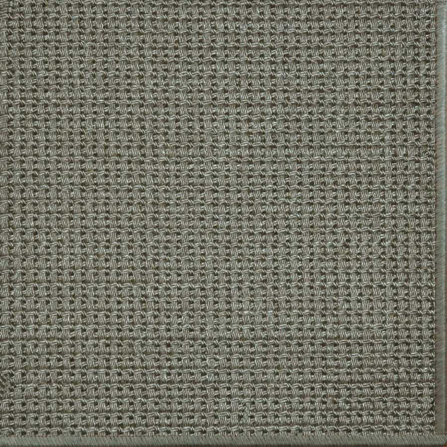 Close-up of a textured woven performance carpet in greige.