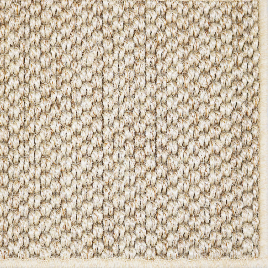 Close-up of a textured woven broadloom in cream.