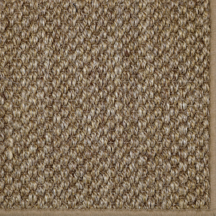 Close-up of a textured woven broadloom in brown.