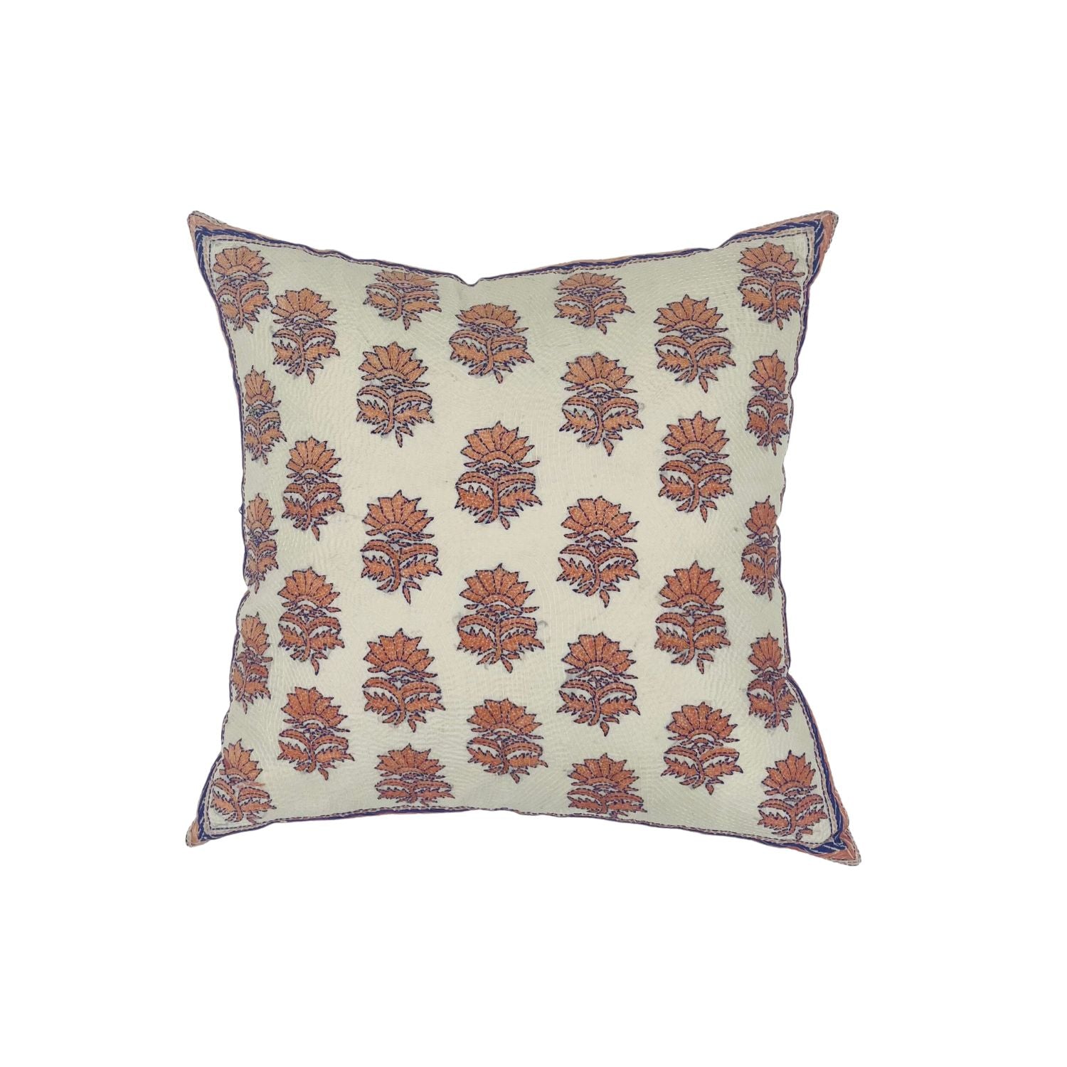 Throw pillow with printed and embroidered floral pattern in coral and purple on white.