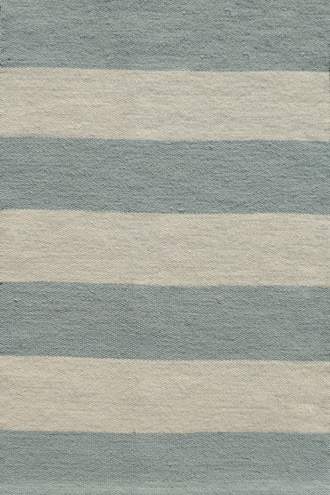Handwoven rug with wide stripes in cream and light blue. 