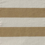 Handwoven rug with wide stripes in cream and tan. 