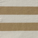 Handwoven rug with wide stripes in cream and tan. 
