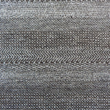 Handknotted rug with small scale geometric pattern in dark brown and ivory. 