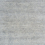 Handknotted rug with small scale geometric pattern in light grey.