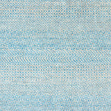 Handknotted rug with small scale geometric pattern in turquoise blue and pale grey. 