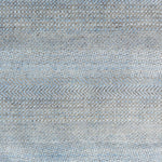 Handknotted rug with small scale geometric pattern in grey and blue. 