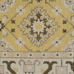 Close-up of a patterned rug with geometric design on a yellow background