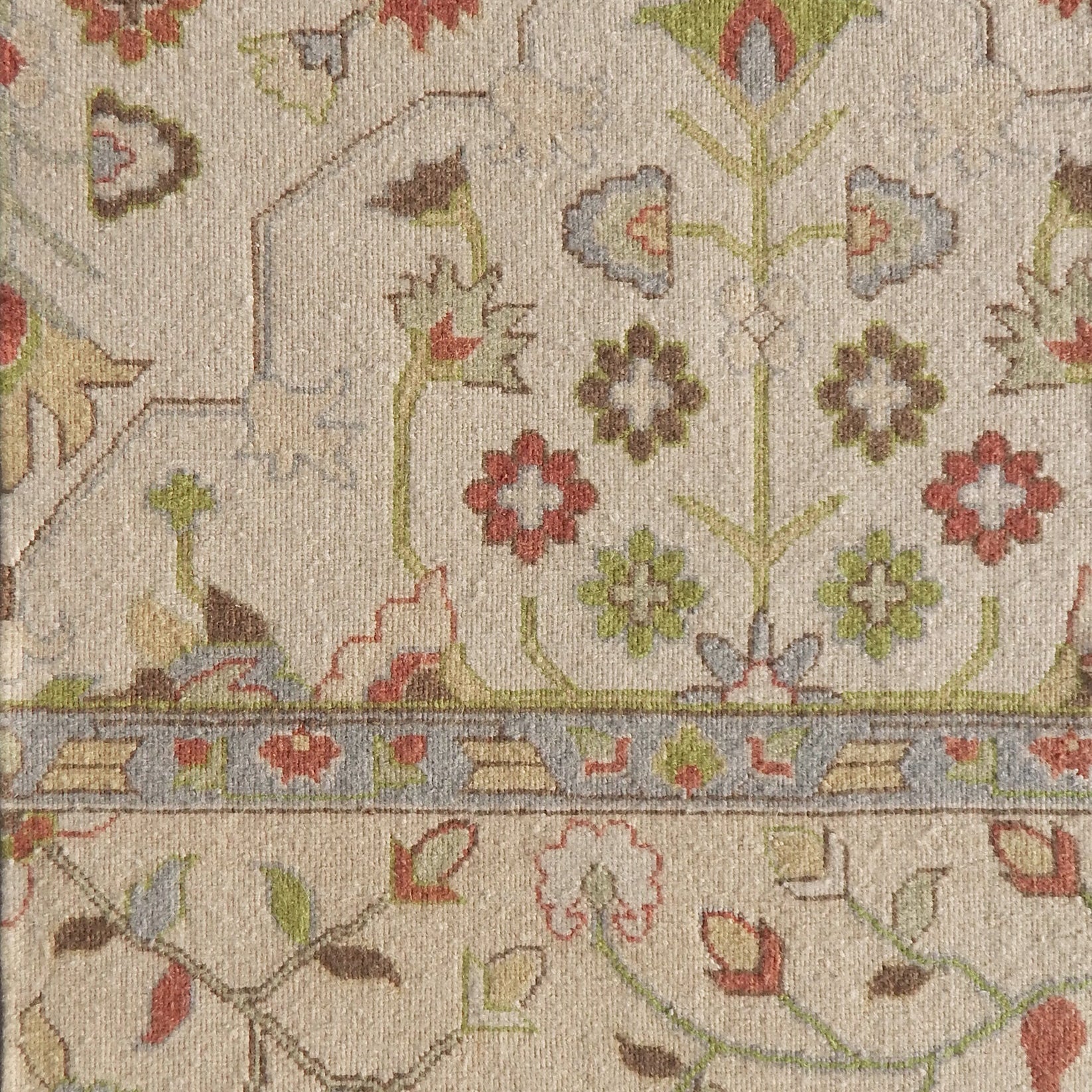 Decorative floral patterned rug with intricate design on a beige background