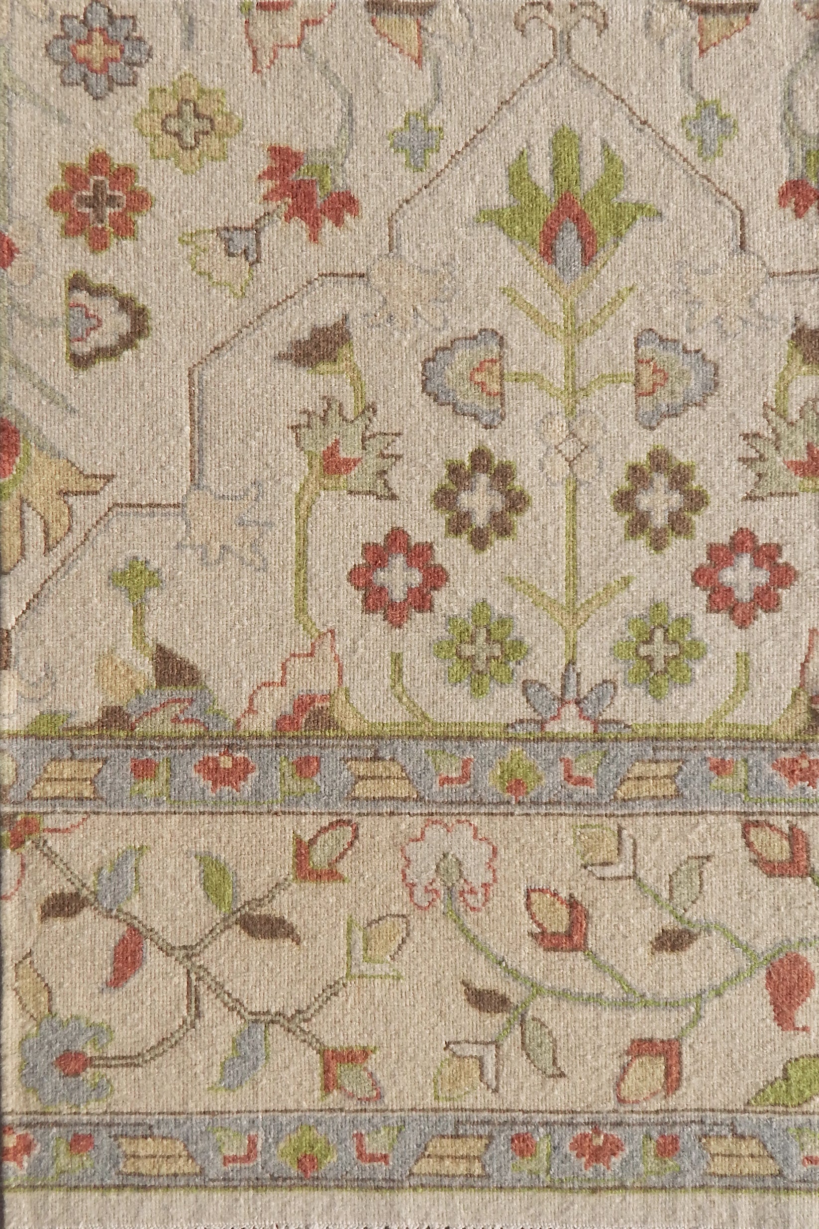 Decorative floral patterned rug with intricate design on a beige background