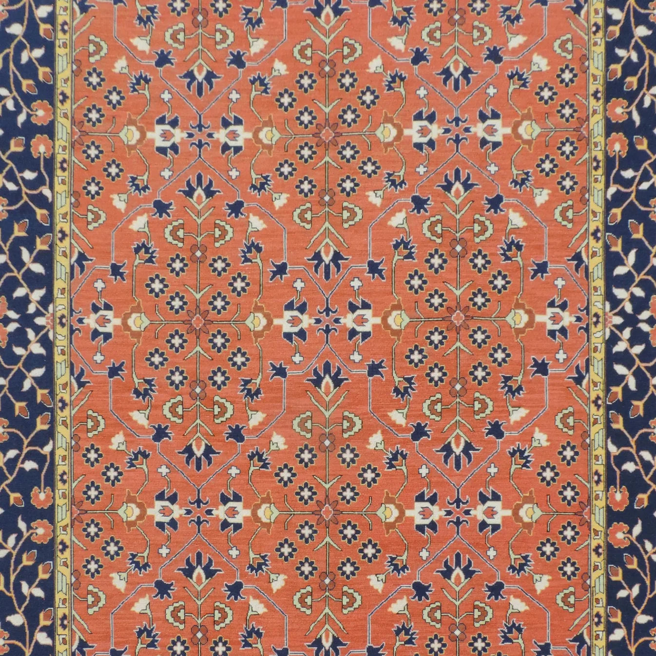 Decorative rug with intricate pattern on a red and blue background