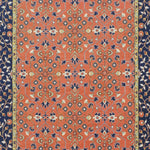 Decorative rug with intricate pattern on a red and blue background